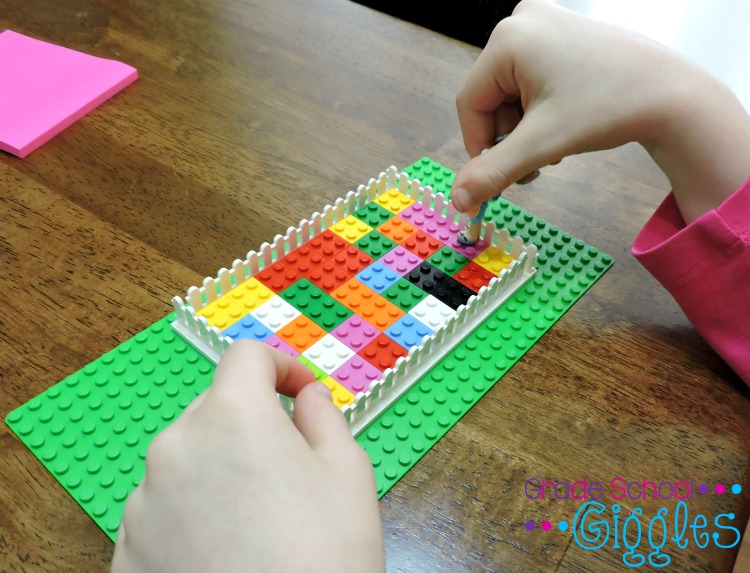 A child is walking a small doll around the perimeter of the rectangle. She is calculating the area and perimeter.